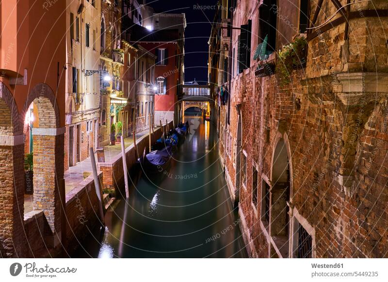 Italy, Venice, Narrow canal at night landmark sight place of interest historic historical ancient by night nite night photography moored anchor anchored