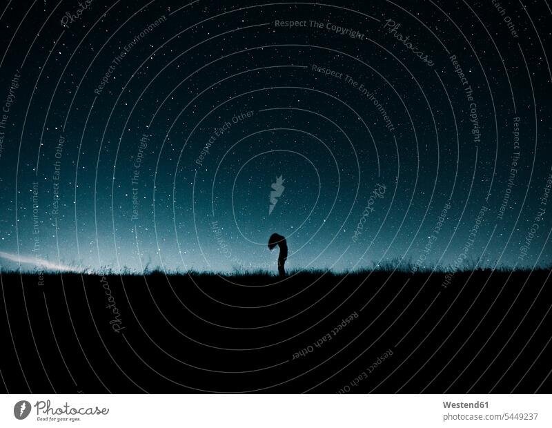 Austria, Mondsee, silhouette of woman standing under starry sky Starscape universe outer space females women night by night at night nite night photography