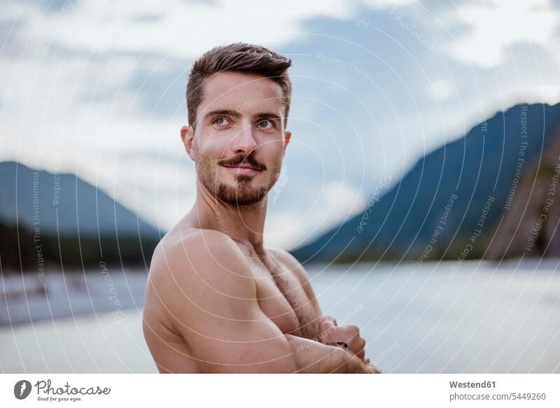 Germany, Bavaria, portrait of shirtless young man in nature portraits men males Adults grown-ups grownups adult people persons human being humans human beings