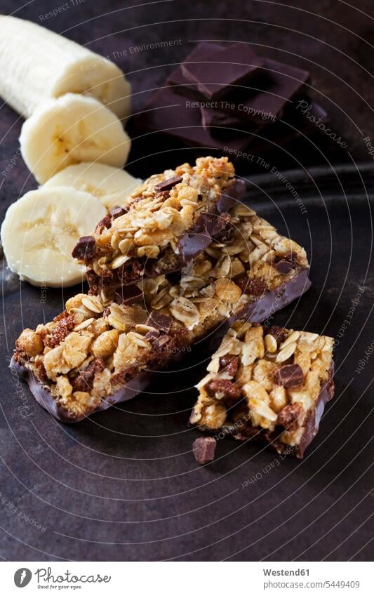 Muesli bars with oat flakes, banana and chocolate nobody Nut Nuts granola bar power bar muesli bar focus on foreground Focus In The Foreground