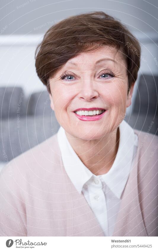 Portrait of a senior woman, smiling females women senior women elder women elder woman old Adults grown-ups grownups adult people persons human being humans