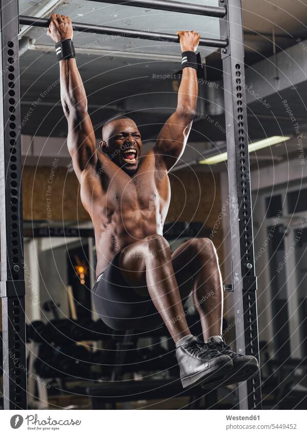 Athlete doing push ups in gym chin-ups pull-ups Muscular Build muscular muscles athletic gyms Health Club athlete Sportspeople Sportsman Sportsperson athletes