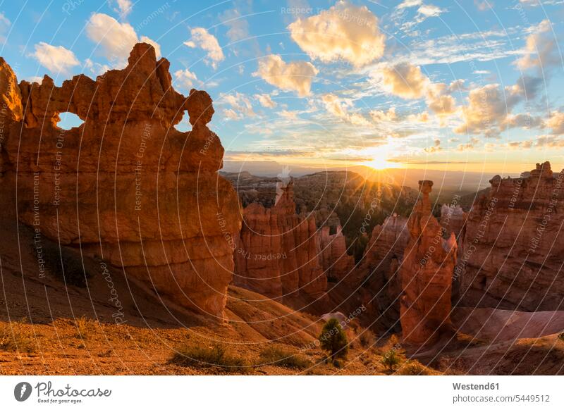 USA, Utah, Bryce Canyon National Park, Thors Hammer and other hoodoos in amphitheater at sunrise as seen from Navajo Loop Trail landmark sight place of interest