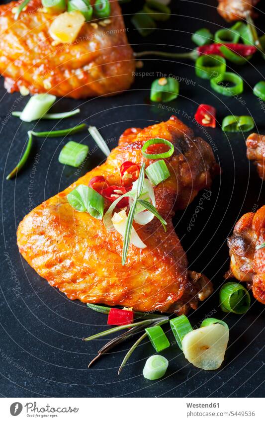 Marinated and grilled chicken wings on slate overhead view from above top view Overhead Overhead Shot View From Above spring onion spring onions spice