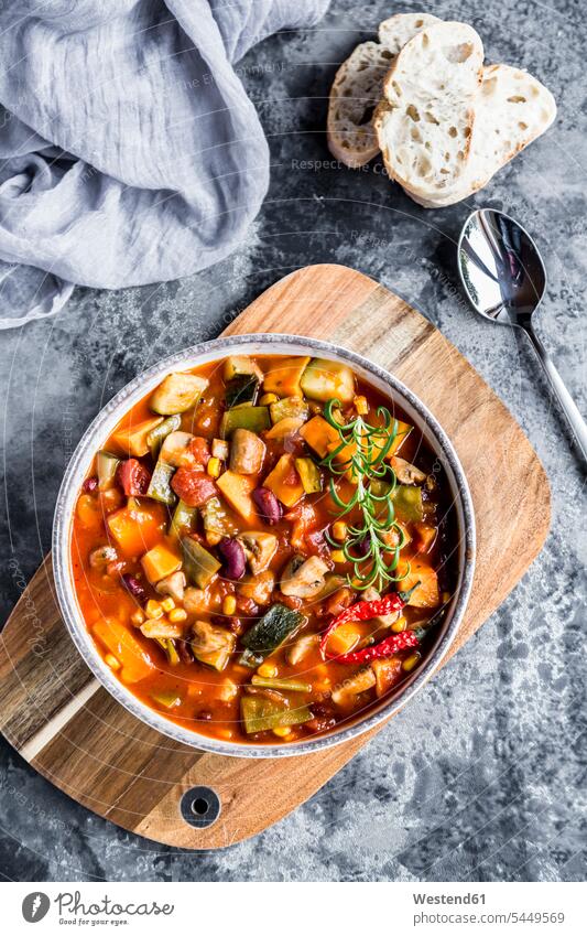 Vegetable chili with kidney bean, sweet potatoe, champignon, corn, snow pea, baguette in bowl Bowl Bowls elevated view High Angle View High Angle Shot Slice