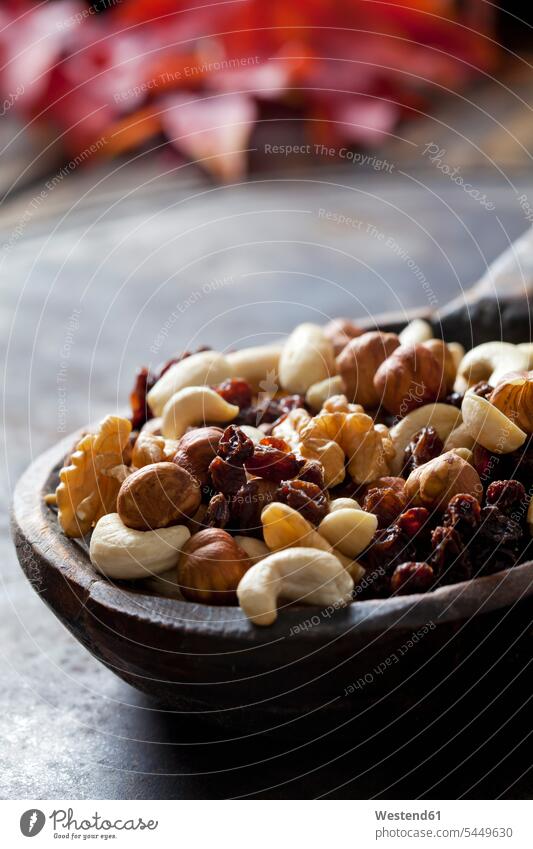 Wooden spoon of trail mix, close-up nobody copy space healthy eating nutrition variation many plenty large group of objects many objects munchies nibbles raisin
