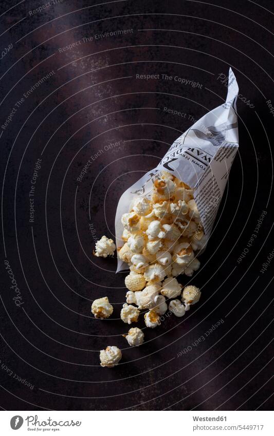 Paper bag of popcorn on rusty background overhead view from above top view Overhead Overhead Shot View From Above Popcorn Popcorns close-up close up closeups