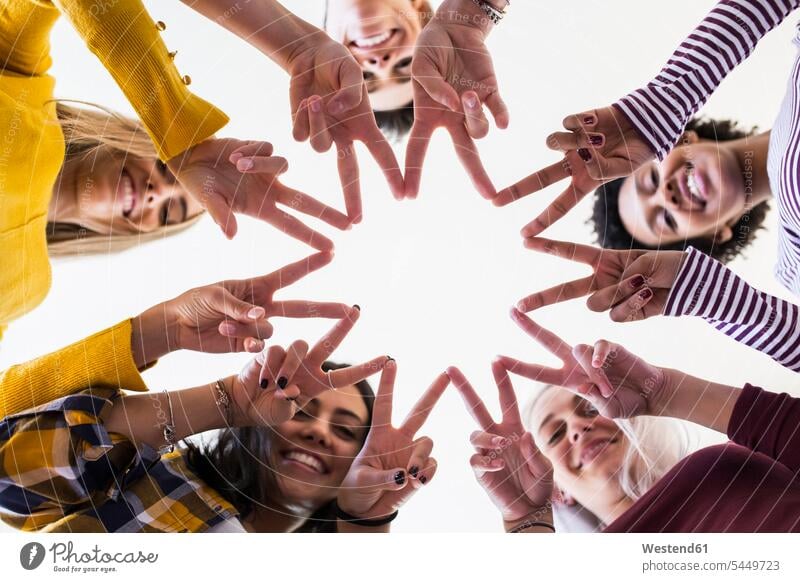 Close-up of hands of five women shaping a star Star Shape Star Shapes Star Shaped star-shaped stars shapes community Companionship human hand human hands