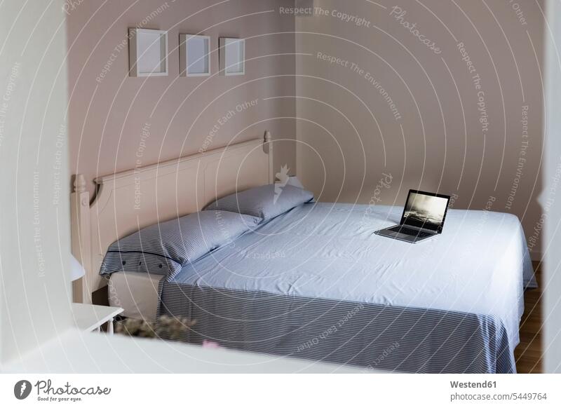 Laptop on a bed bedroom Domestic Bedroom laptop Laptop Computers laptops notebook home at home beds rooms domestic room domestic rooms computer computers