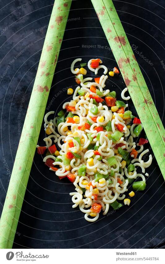 Noodle salad with corn and bell pepper on dark ground nobody Green Bell Pepper Green Bell Peppers Red Bell Pepper red pepper Red Bell Peppers Part Of