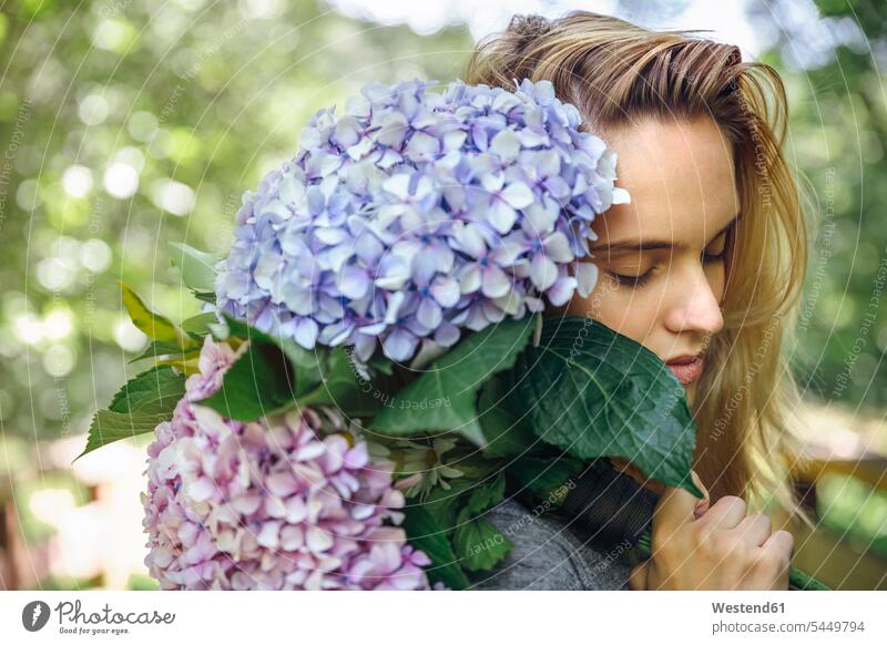 Young woman with closed eyes holding a bouquet of hydrangeas Bunch of Flowers Bouquet Flower Bouquet Bouquet of Flowers Flower Bouquets Bunches of Flowers