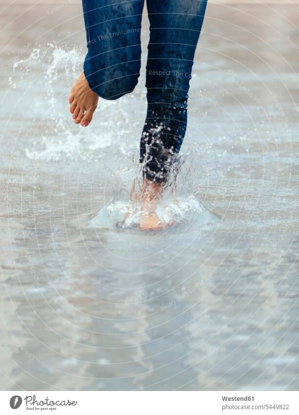 Girl running barefoot in pool, close up splash water splash of water pools leg legs human leg human legs naked feet naked foot Barefeet Bare Feet Bare Foot
