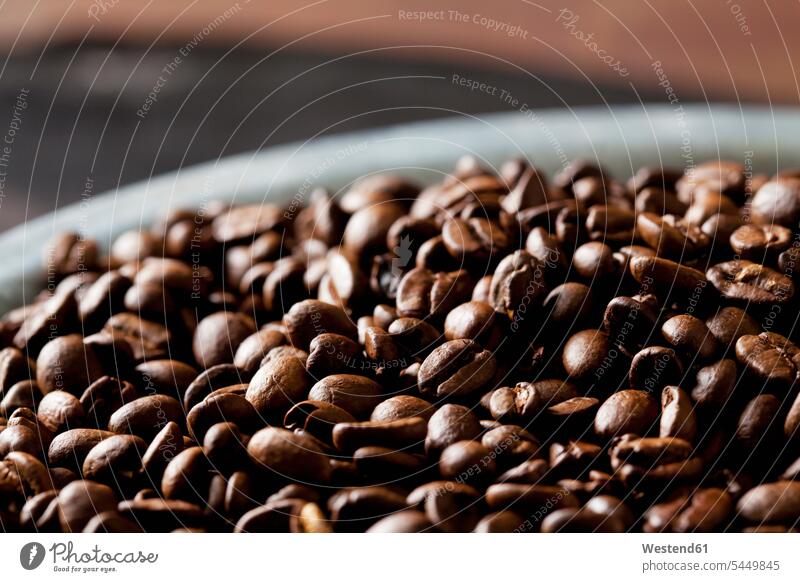 Freshly roasted coffee beans in a bowl Coffee Crops aroma flavour aromatic close-up close up closeups close ups close-ups Roasted Coffee Bean