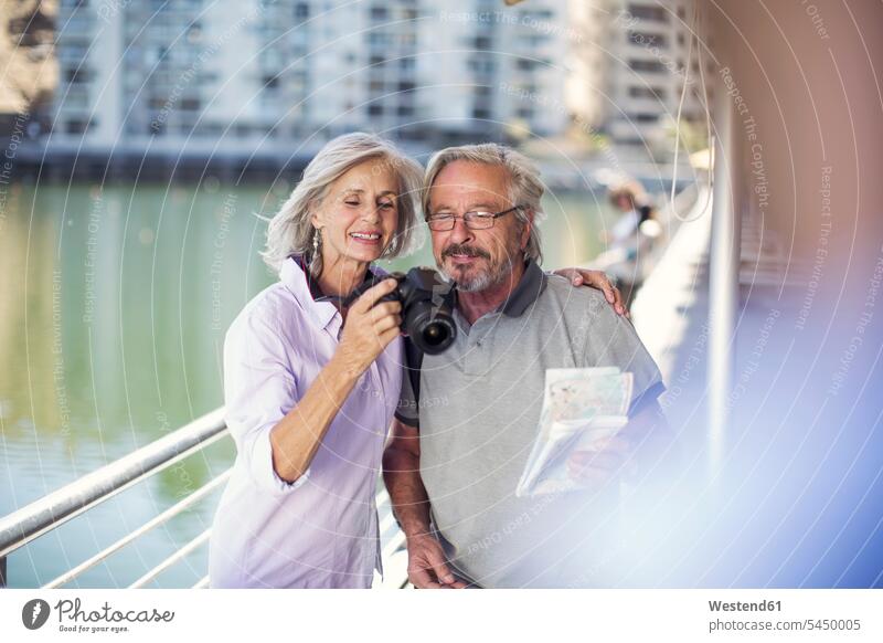 Senior couple taking a city break, taking photos City Break City Trip Urban Tourism happiness happy photographing twosomes partnership couples on the move
