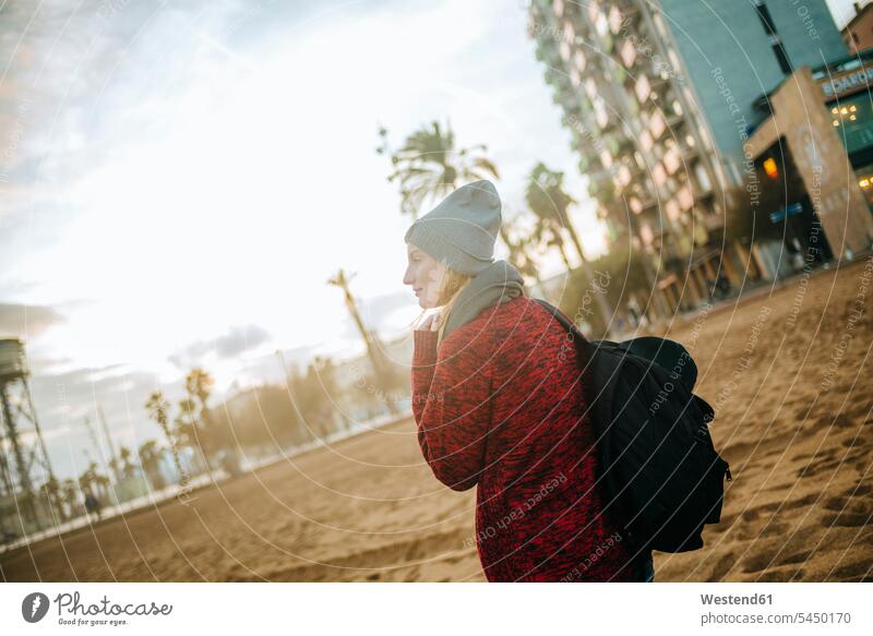 Spain, Barcelona, young woman on the beach in winter beaches females women Adults grown-ups grownups adult people persons human being humans human beings