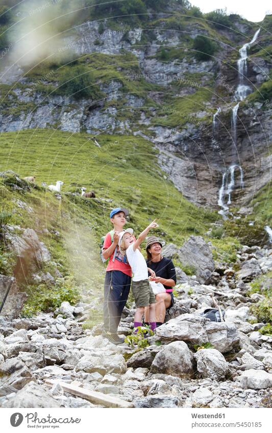 Austria, South Tyrol, family hiking standing families mother mommy mothers ma mummy mama female hiker female wanderers Looking At View Looking at a view