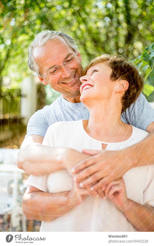 Portrait of happy senior couple outdoors twosomes partnership couples embracing embrace Embracement hug hugging smiling smile people persons human being humans