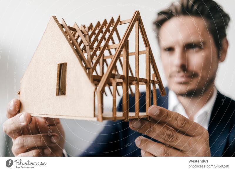 Close-up of architect examining architectural model models man men males looking eyeing architects Adults grown-ups grownups adult people persons human being