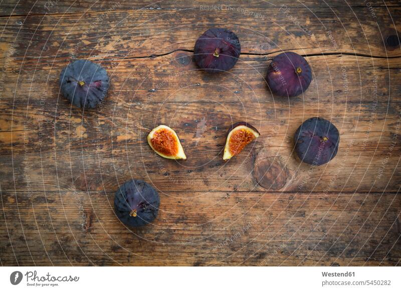 Organic figs on wood food and drink Nutrition Alimentation Food and Drinks Fruit Fruits healthy eating nutrition organic organic edibles wooden sliced brown