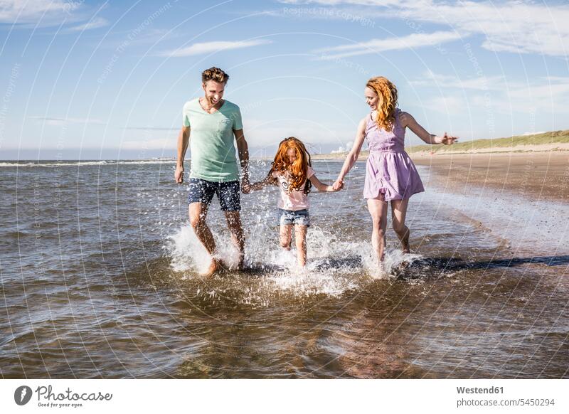 Netherlands, Zandvoort, happy family splashing in the sea happiness beach beaches families Fun having fun funny Sea ocean people persons human being humans