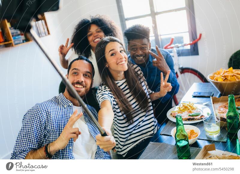 Group of friends posing for a selfie at dining table at home Table Tables Selfie Selfies Fun having fun funny mobile phone mobiles mobile phones Cellphone