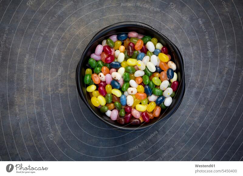 Bowl of colourful sweet jellybeans on grey background food and drink Nutrition Alimentation Food and Drinks jelly beans Sugary sweets Sweets Candies Sweet Food