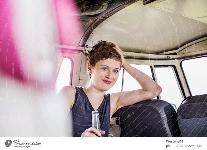 Portrait of smiling woman inside a van females women portrait portraits smile Adults grown-ups grownups adult people persons human being humans human beings