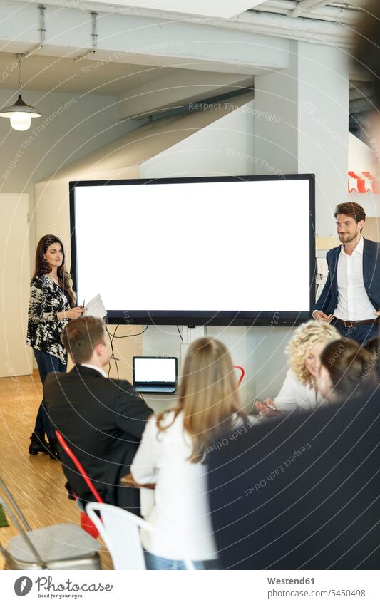 Presentation in office at large screen business people businesspeople training training course businesswoman businesswomen business woman business women