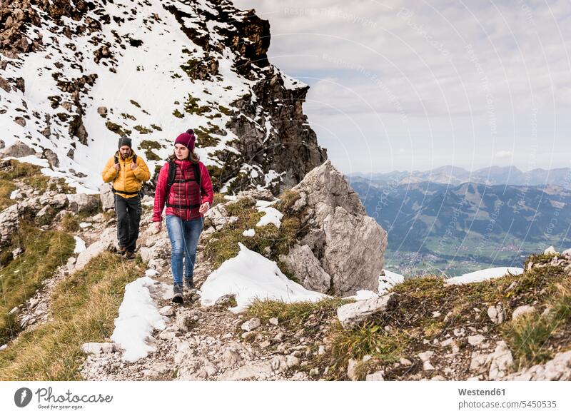 Germany, Bavaria, Oberstdorf, two hikers walking in alpine scenery hiking mountain range mountains mountain ranges couple twosomes partnership couples going