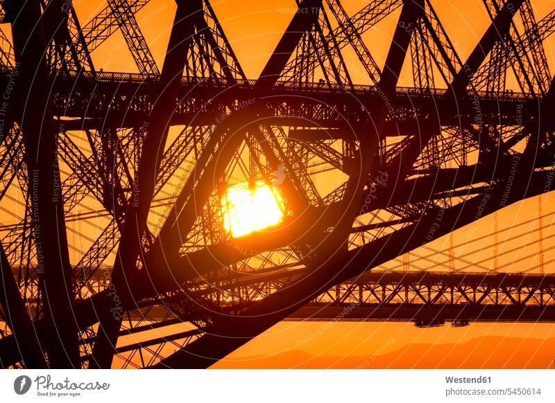 UK, Scotland, Fife, Edinburgh, close-up of Firth of Forth estuary, Forth Bridge, Forth Road Bridge and Queensferry Crossing Bridge in the background at sunset