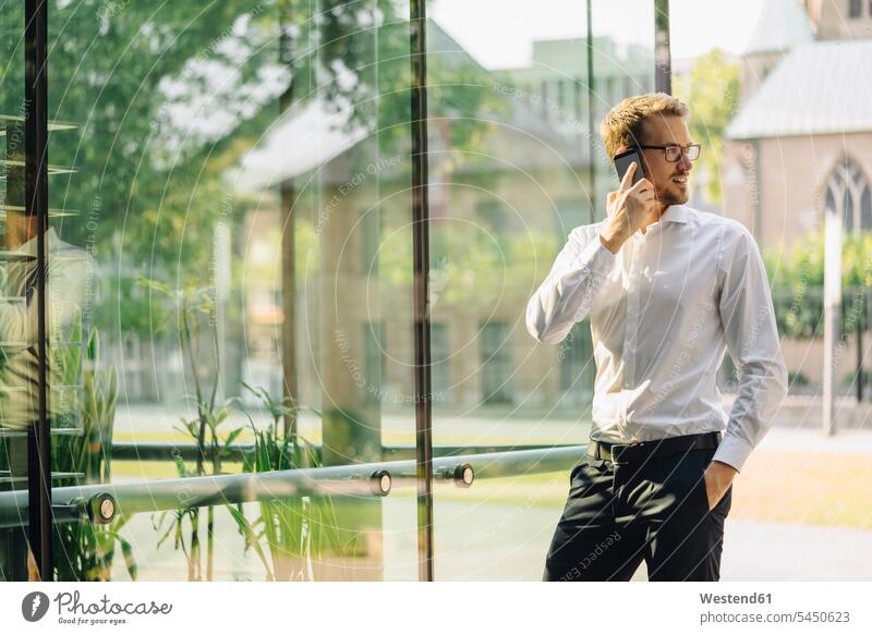 Businessman talking on cell phone business life business world business person businesspeople Business man Business men Businessmen telecommunication phones
