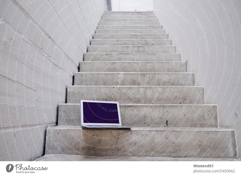 Laptop on stairs laptop Laptop Computers laptops notebook stairway computer computers business business world business life Mobility mobile mobile working