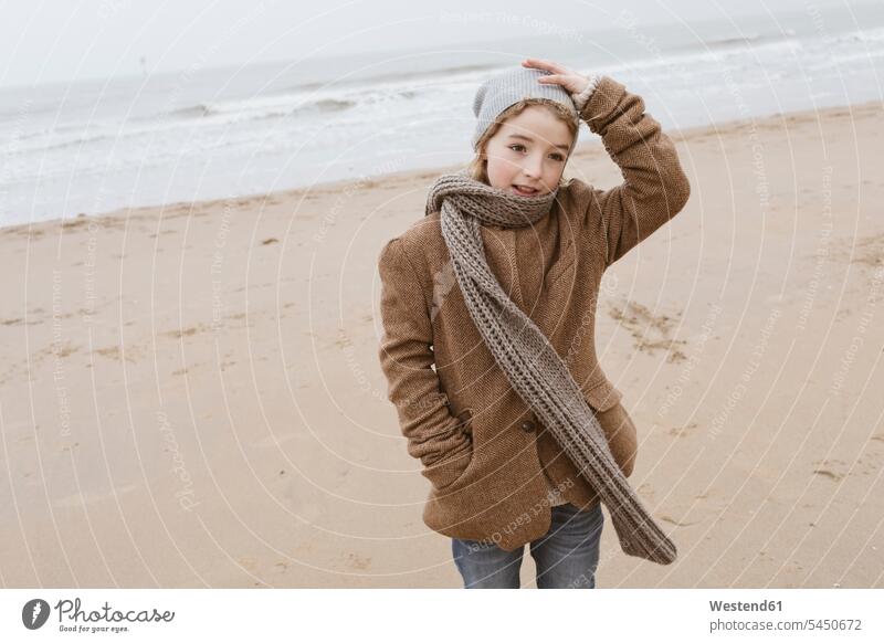 Portrait of boy standing on the beach in winter beaches boys males portrait portraits hibernal child children kid kids people persons human being humans