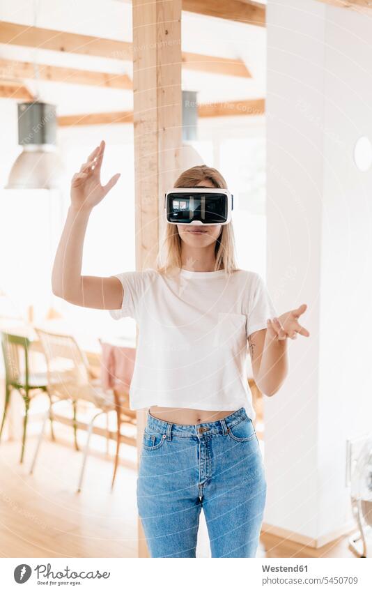 Young woman wearing VR goggles, designing her new home loft lofts Virtual Reality Glasses VR glasses Virtual-Reality Glasses virtual reality headset vr headset