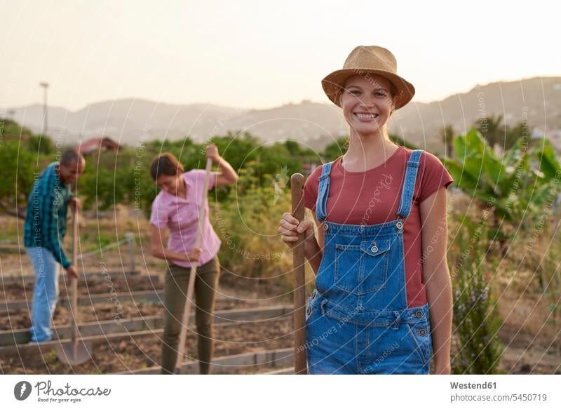 Portrait of smiling young farmer portrait portraits woman females women Adults grown-ups grownups adult people persons human being humans human beings working
