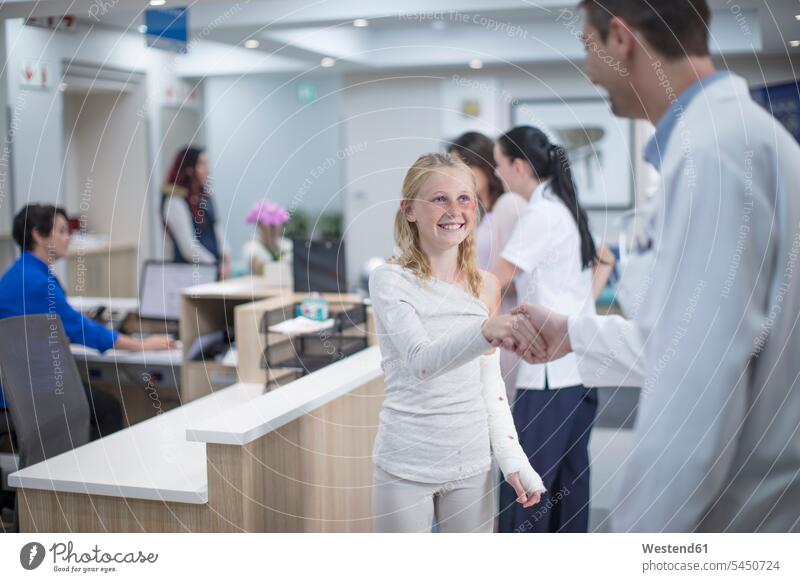 Sick girl greeting doctor at reception area in hospital physicians doctors patient Medical Clinic clinic hospitals healthcare and medicine medical