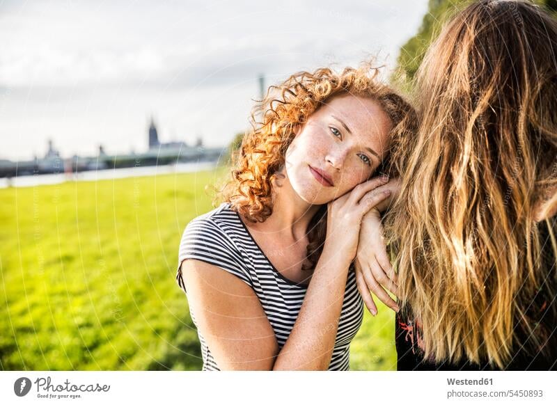 Germany, Cologne, portrait of redheaded young woman with friend females women portraits Adults grown-ups grownups adult people persons human being humans