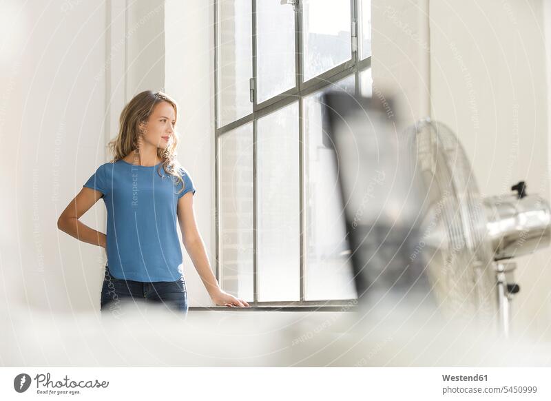 Casual businesswoman in office looking out of window pensive thoughtful Reflective contemplative entrepreneur entrepreneurs businesswomen business woman