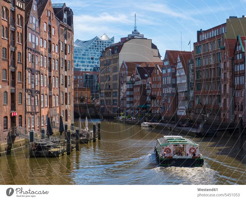 Germany, Hamburg, historic buildings at Nicolaifleet with Elbe Philharmonic Hall in the background cloud clouds water reflection water reflections