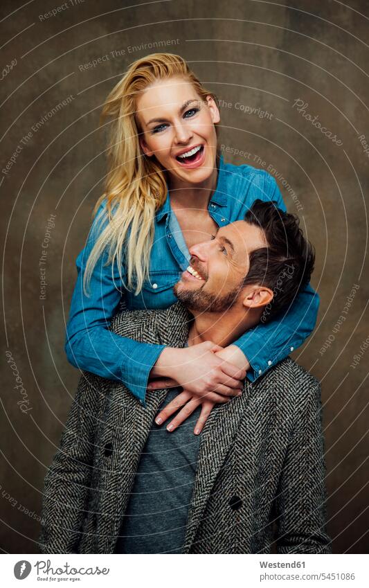 Portrait of happy couple portrait portraits happiness twosomes partnership couples people persons human being humans human beings arm around arms around bonding
