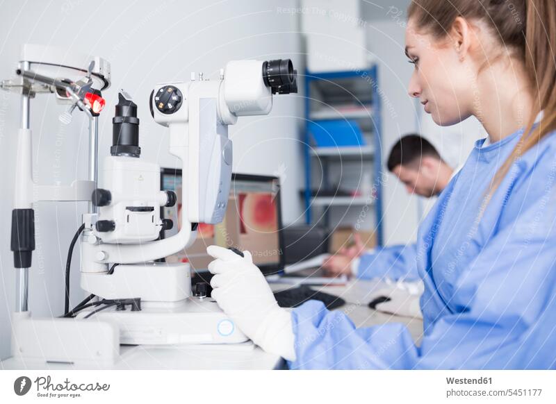 Lab technician working with microscope in lab microscopes laboratory examining checking examine At Work laboratory technician Lab Tech workplace work place