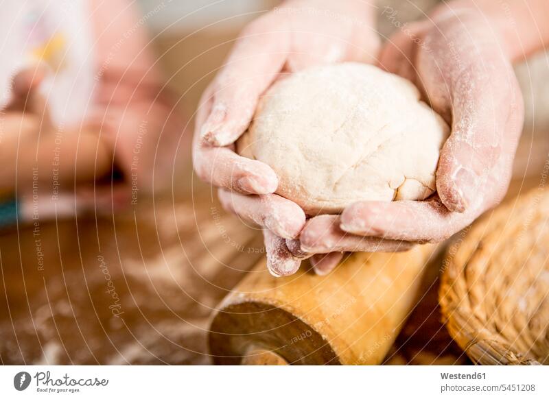 Close-up of hands holding dough human hand human hands woman females women people persons human being humans human beings Adults grown-ups grownups adult Food