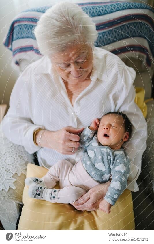 Great grandmother taking care of her great granddaughter at home great-grandmother great-grandmothers great-granddaughter great-granddaughters grandmas granny