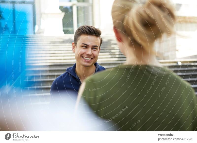 Portrait of happy young man face to face to his girlfriend men males Adults grown-ups grownups adult people persons human being humans human beings laughing