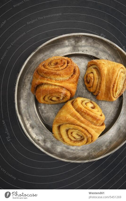 Home-baked Franzbroetchen Pastry Pastries rolled rolling filled dark background Plate dish dishes Plates delicacy specialty specialties Baked Food overhead view
