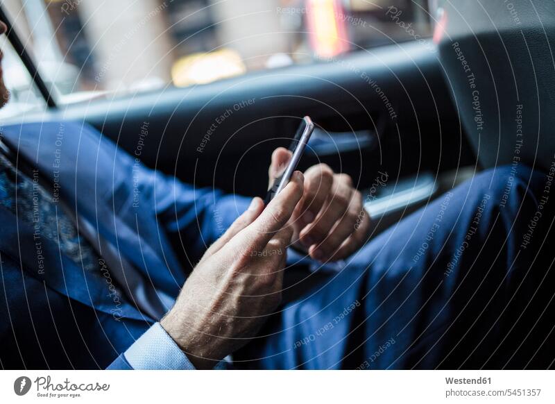 Businessman using smart phone, close up attractive beautiful pretty good-looking Attractiveness Handsome riding taxi Taxies sitting Seated Business man