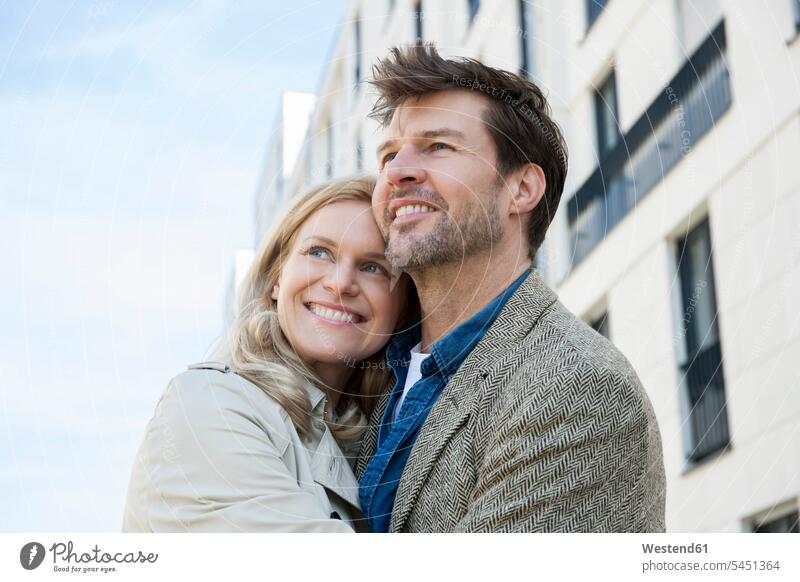 Happy couple watching something twosomes partnership couples portrait portraits people persons human being humans human beings looking looking at smiling smile