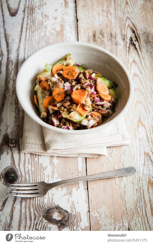 Lentil salad with carrot, cucumber and red radish Bowl Bowls elevated view High Angle View High Angle Shot healthy eating nutrition wooden napkin napkins