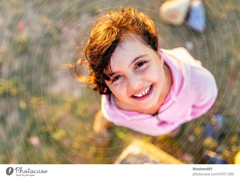 Portrait of smiling little girl with blowing hair portrait portraits females girls child children kid kids people persons human being humans human beings