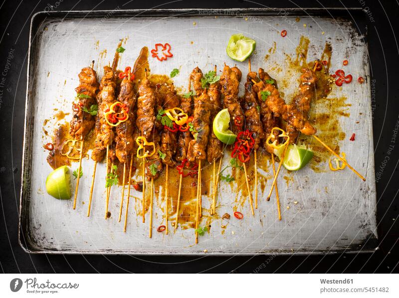 Chicken satay skewers with chili peanut sauce on baking tray food and drink Nutrition Alimentation Food and Drinks sesame fried roast Satay Snack Snacks